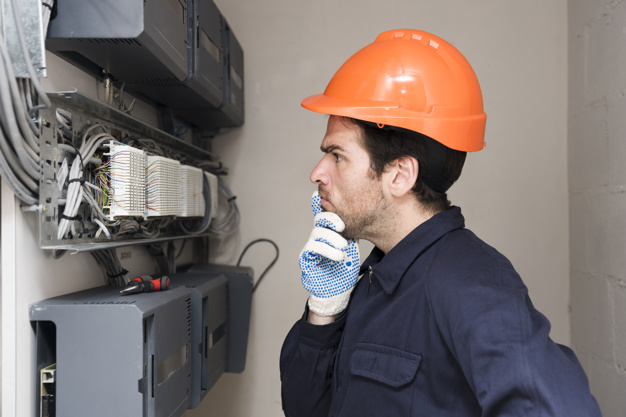 male-electrician-looking-circuit-board-thinking_23-2148087627